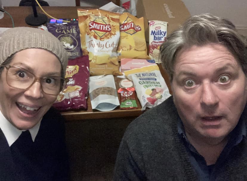 Kitty Flanagan and Dave O'Neil in front of snacks for The Junkees podcast